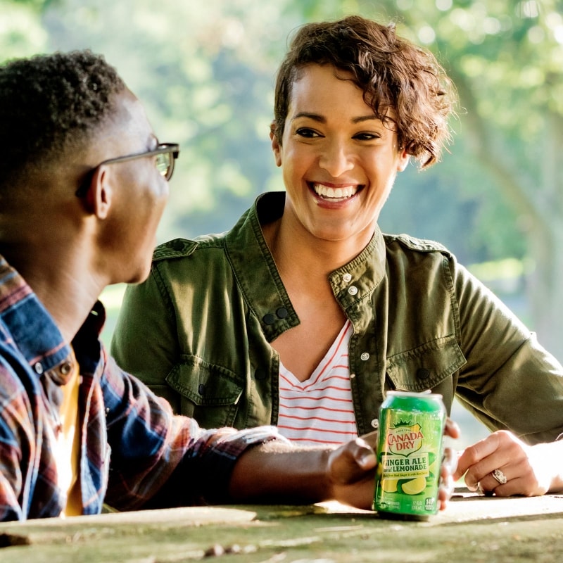 mother and so having a beverage in a park