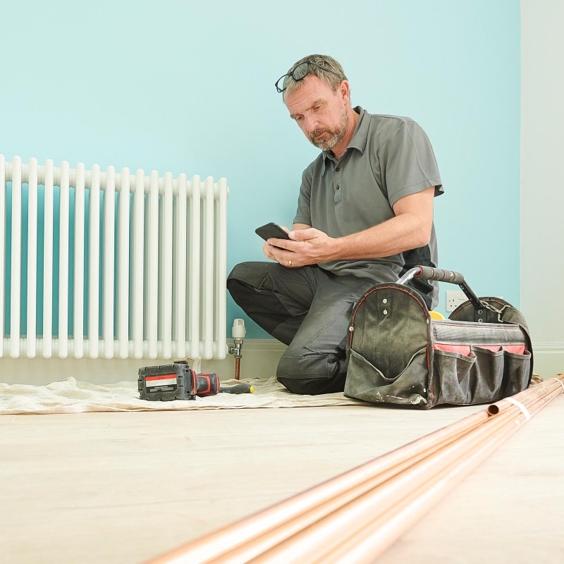 contractor working on a heating system